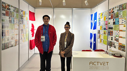 Aiden-James Einish and his science teacher, Shaveta Sharma, next to his booth at the MILSET International Science Fair.